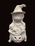 Halloween Witch Sitting on Pumpkin